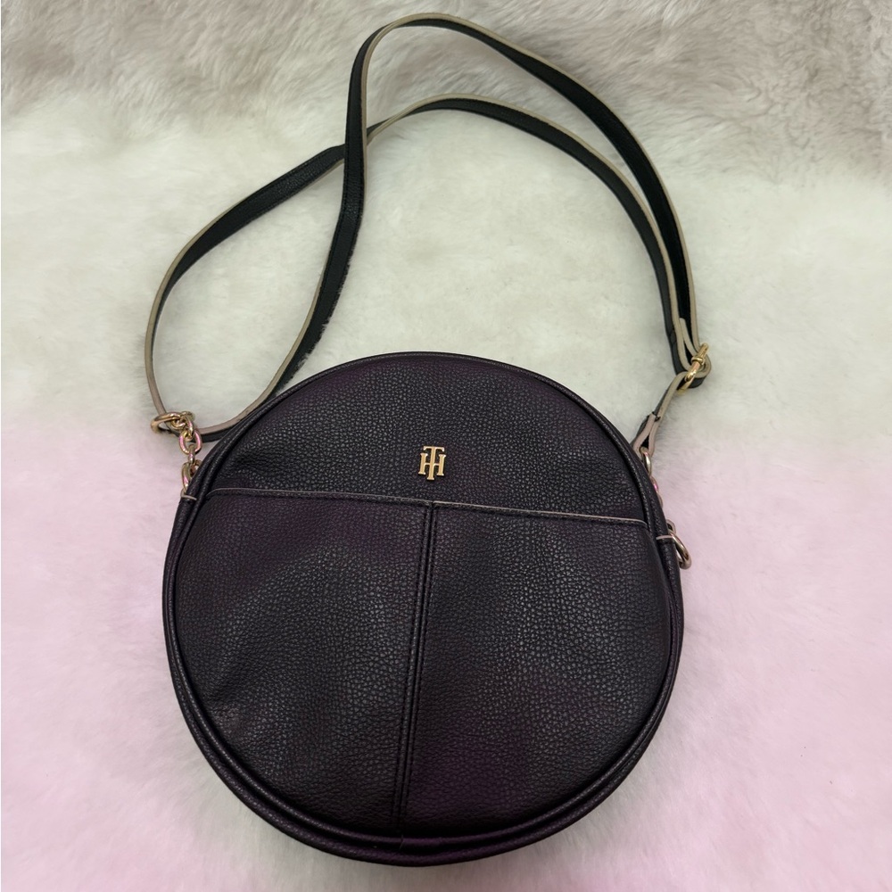 Black leather round shoulder bag with gold details